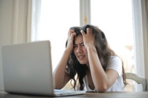 Frustrated women on laptop