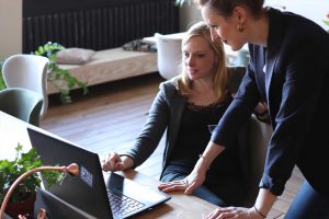 Women looking at computers