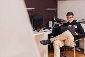 guy on laptop smiling