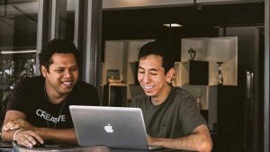 Two guys looking at a computer